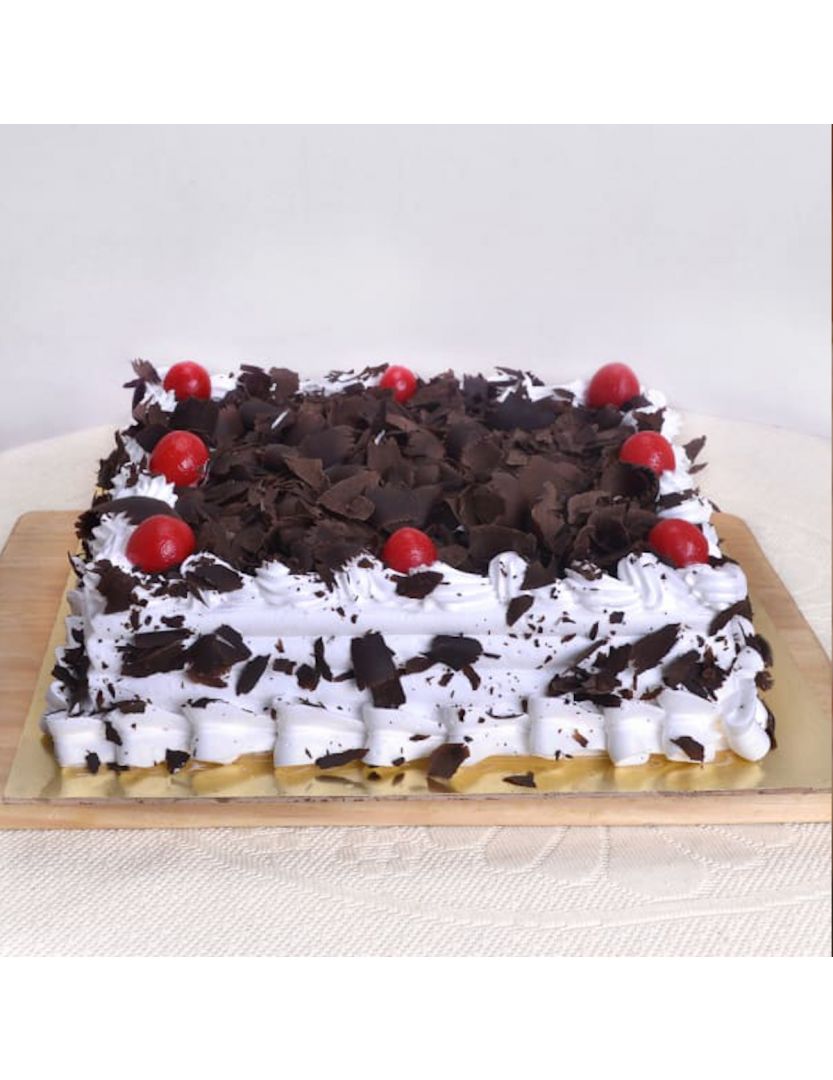 Send Fresh baked irresistible Black Forest Half Kg Square Cake ...